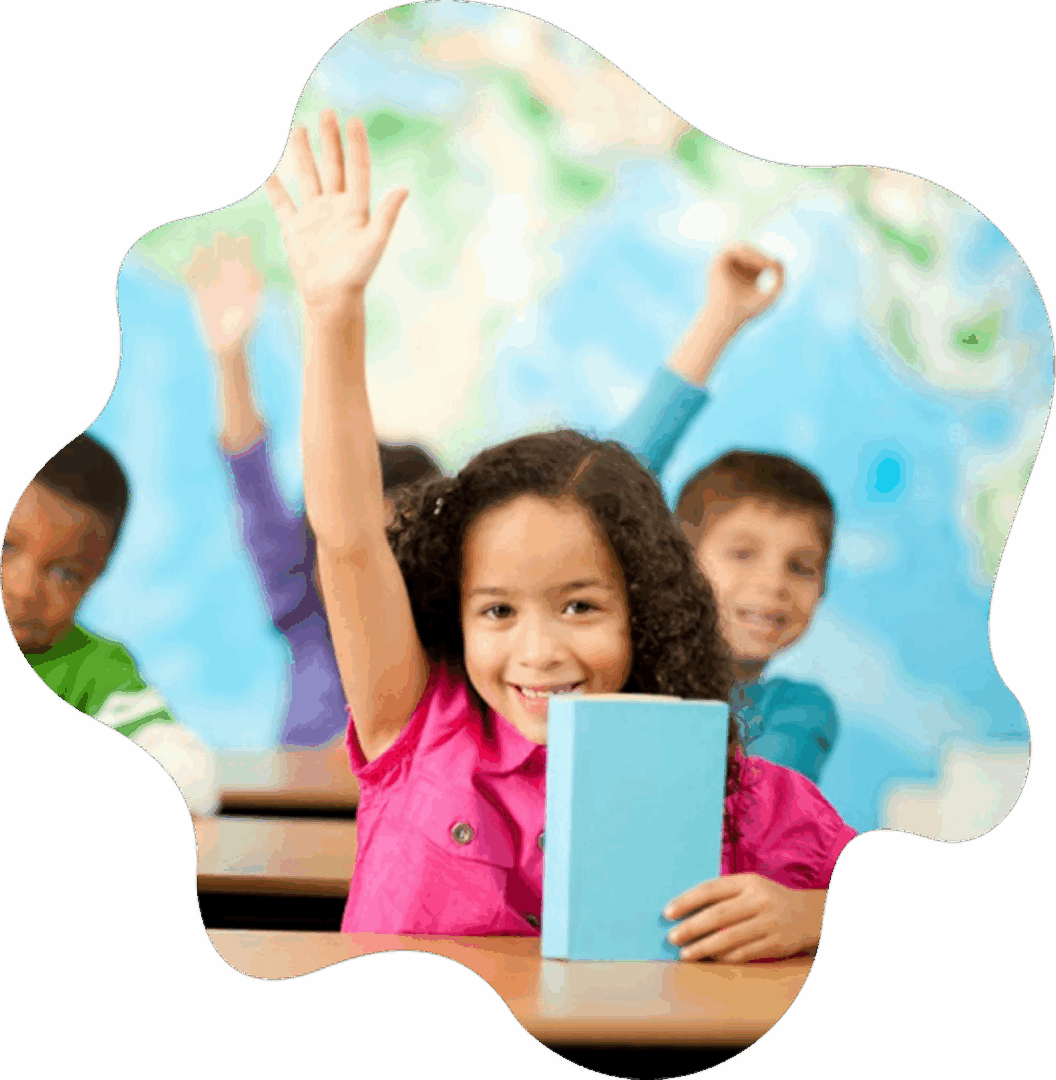 Smiling student raising her hand in class while holding a book — reading success for struggling readers across Northern Nevada
